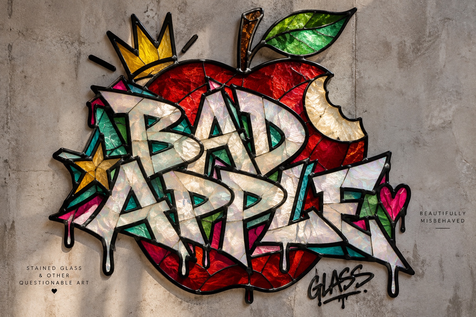 Bad Apple graffiti lettering in iridescent stained glass over a ruby red apple, with a gold crown and jewel-colored glass accents