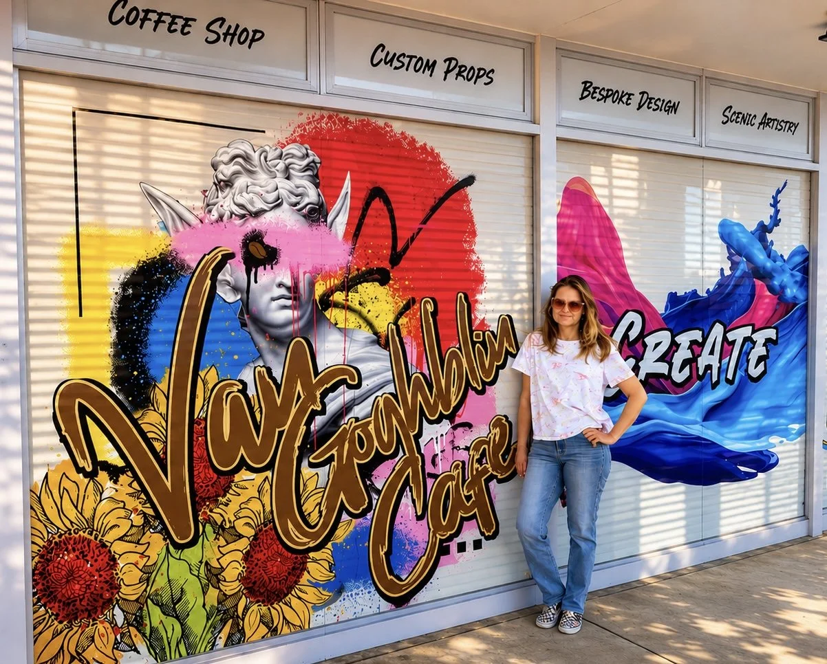 Vanessa outside Van Goghblin Café beside its colorful mural